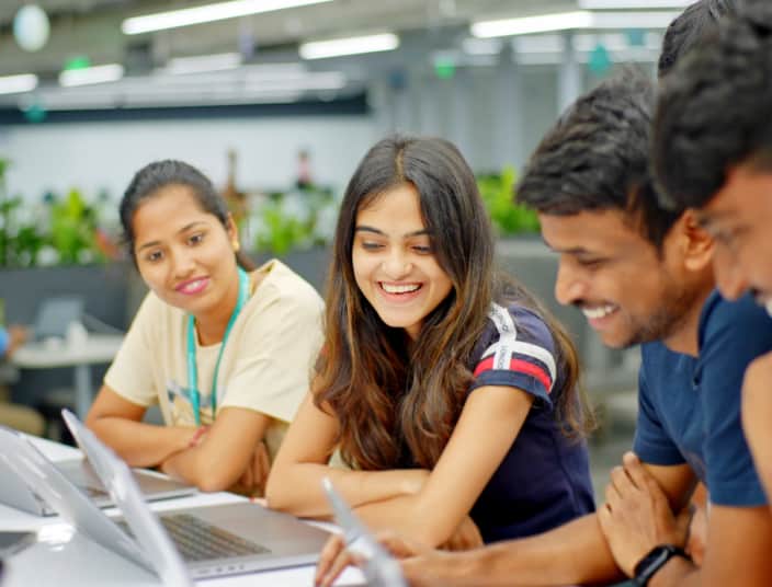 Tekion team members reviewing Automotive Retail Cloud (ARC) features on a computer screen