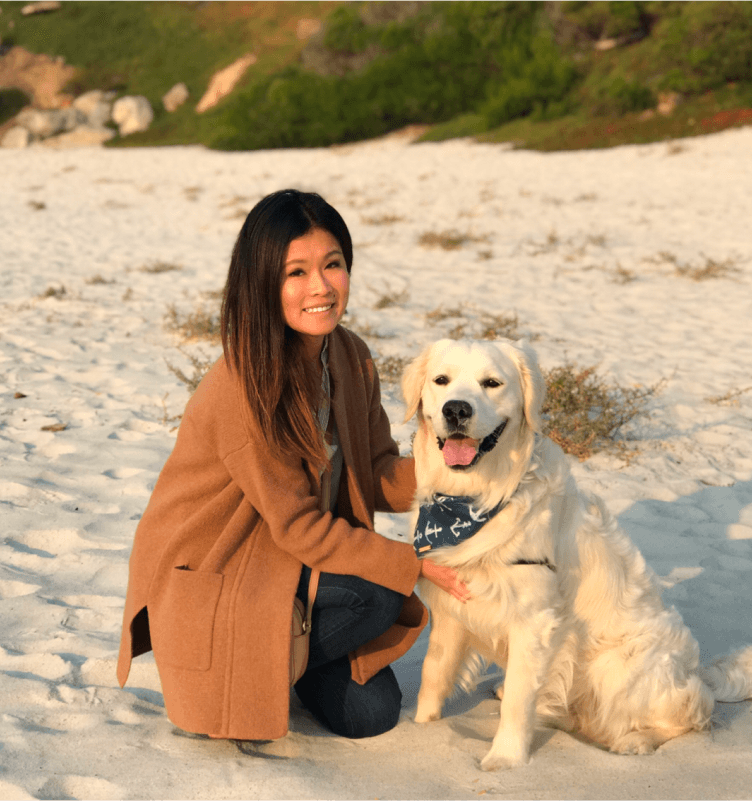 Tekion employee enjoying time with her dog on the beach, exemplifying the work-life balance at Tekion