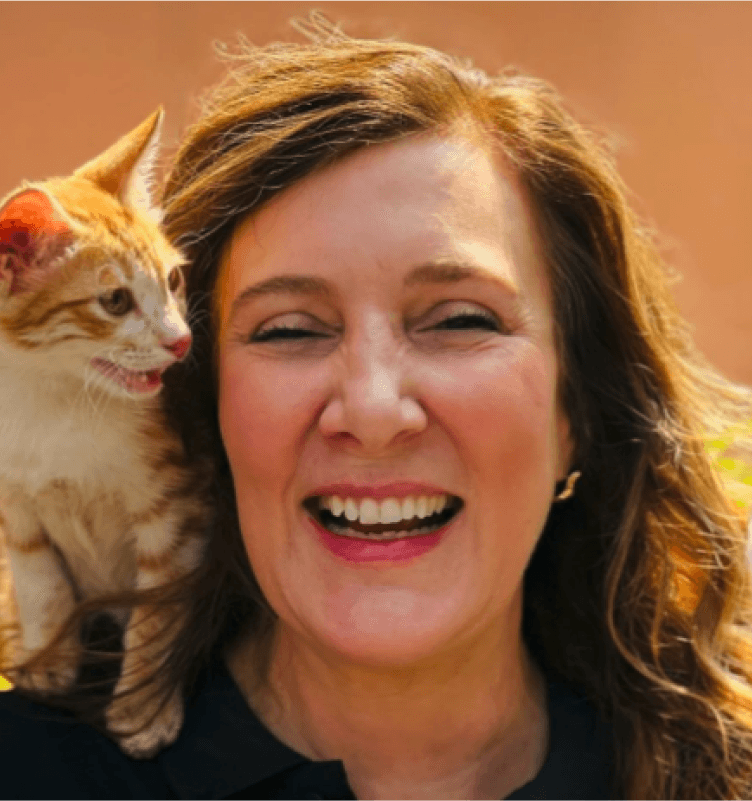 Tekion CPO Rana Robillard with a cat on her shoulders, showcasing the company’s fun and inclusive workplace culture