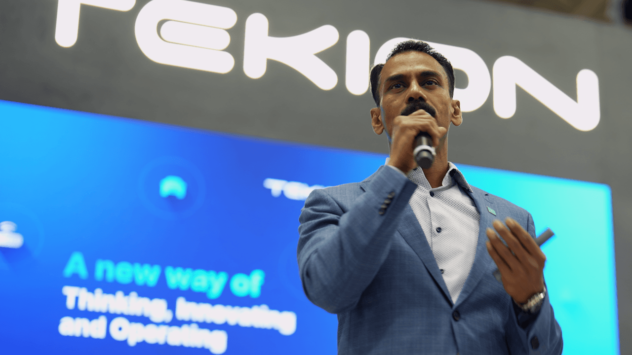 Tekion CEO Jay Vijayan speaking at NADA, showcasing Tekion’s vision for the future of automotive retail